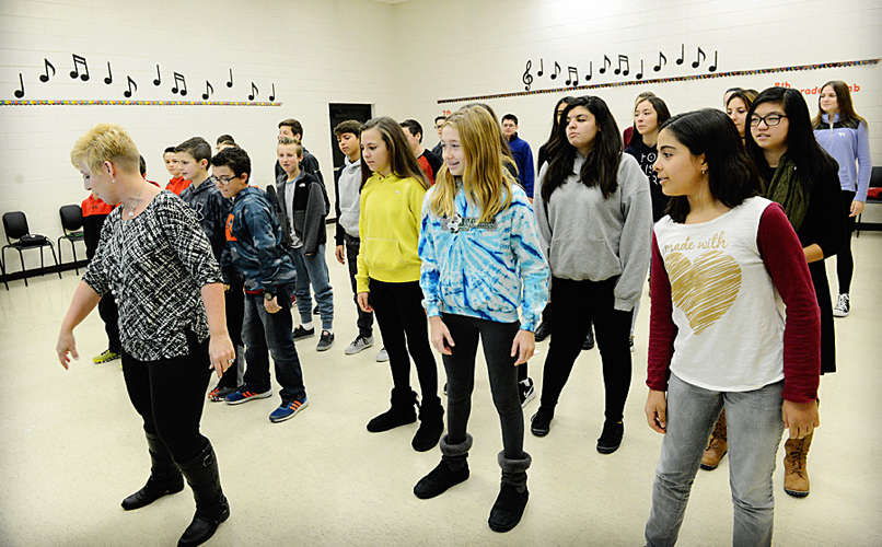 Students learning a dance in class
